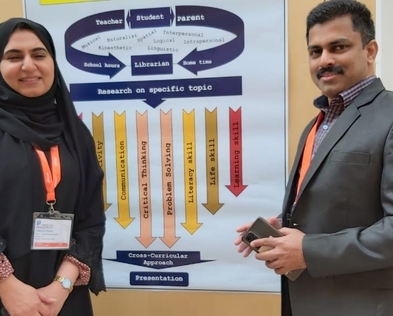 Snapshot of presenter at an international conference poster session.