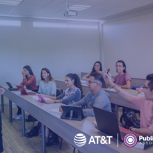 Group of students in a classroom with digital device