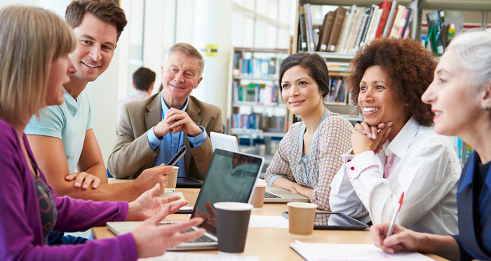 Photo of a group of librarians meeting in a library