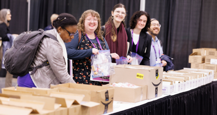 PLA Conference attendees stuffing essentials bags for people experiencing homelessness