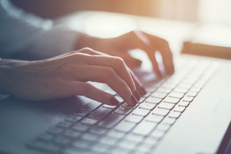 Photo of hands on a keyboard 