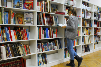 Student browsing books in the library