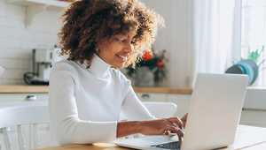 Young professional on laptop at home