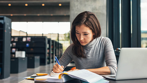 A photo of a woman working in a library